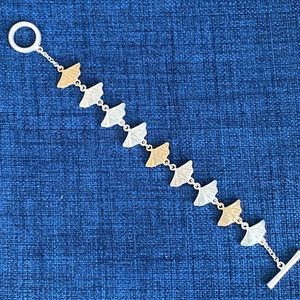 Silver and gold tone bracket w easy toggle closure